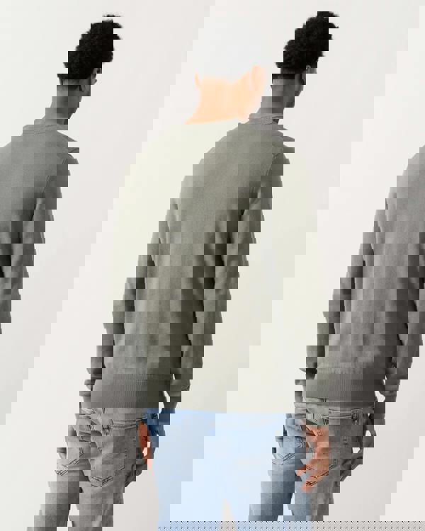 back shot of a model wearing a BOSS Orange Kanovano Mens Crew Neck Jumper in Open Grey 076