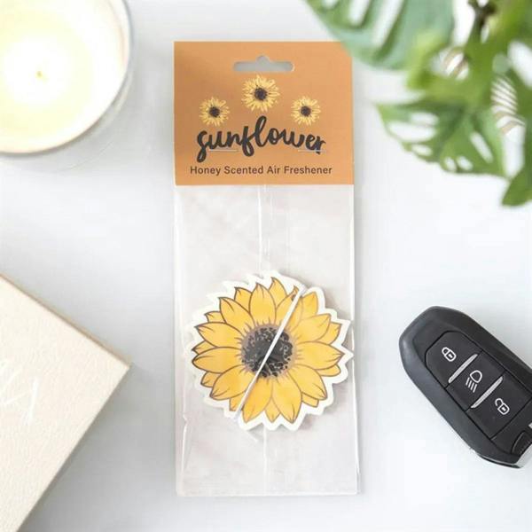 Sunflower honey air freshener card in clear package with hanging string