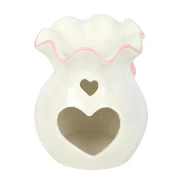 White oil burner with pink bow trim and heart-shaped front cutout
