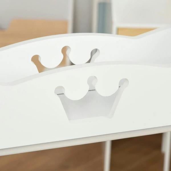 Close-up of the crown-shaped detail on the top shelf of a white kids clothing rack