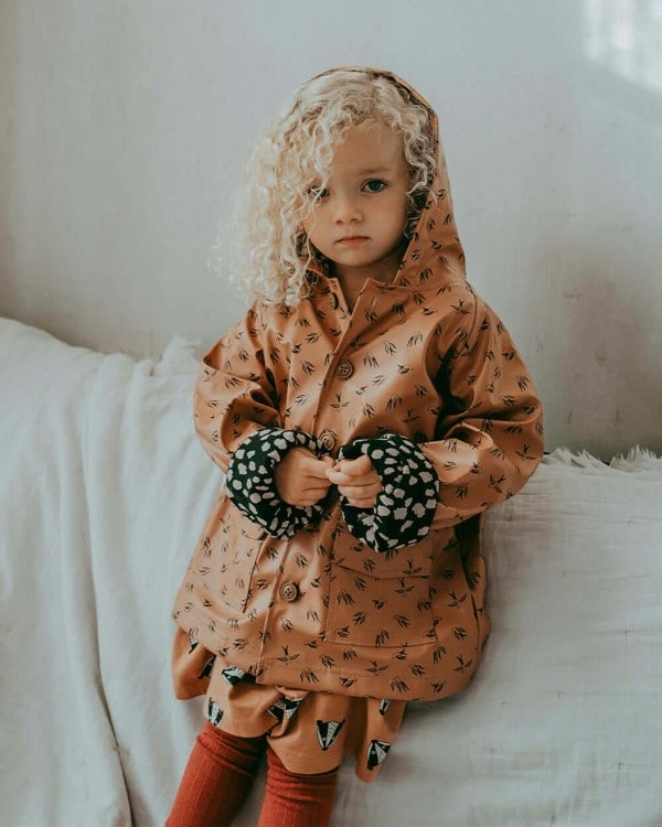Girl wearing sustainable kids waterproof jacket
