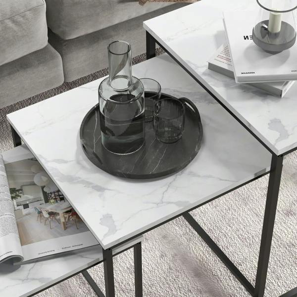 White marble-effect table top with black metal frame and glass centerpiece