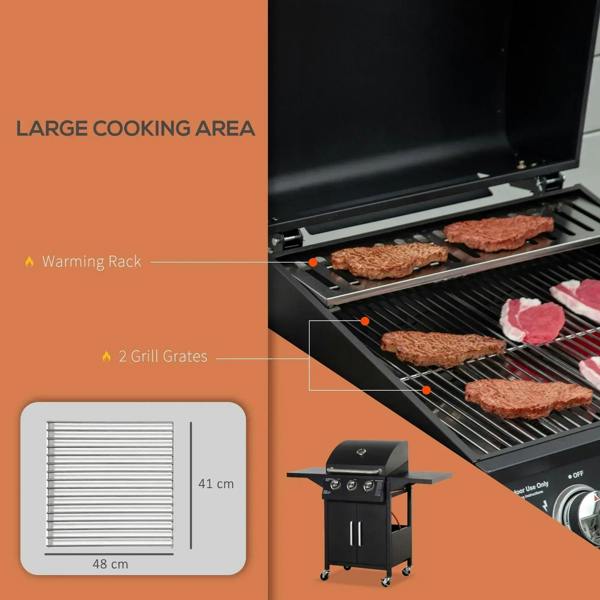 Black grill interior with warming rack and grill grates under the open lid
