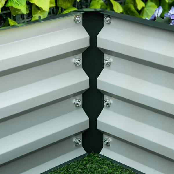 Corner joint inside green raised garden bed with bolts and white interior panels