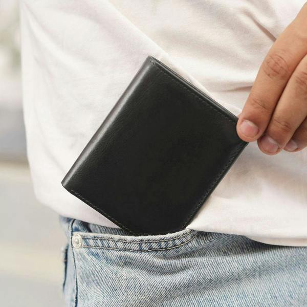 Person holding black leather wallet for men nico tuscan