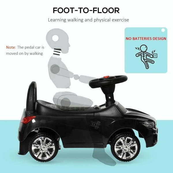 Black ride-on car with foot-to-floor pedal and front wheels