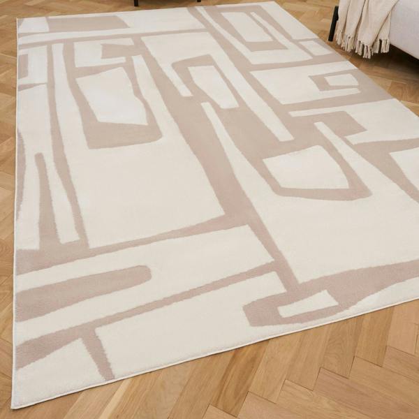 Geometric patterned rug on a wooden floor
