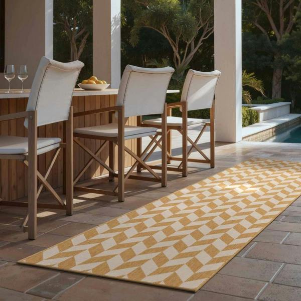 Outdoor patio setting with wooden chairs, table, and patterned rug.