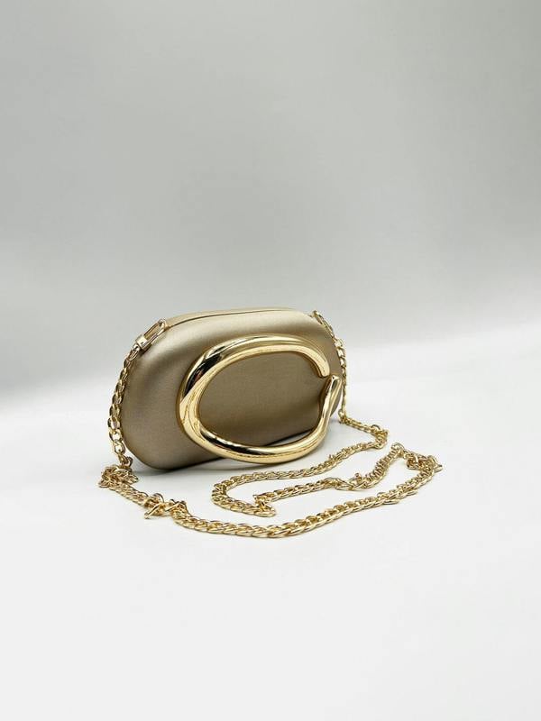 Oval Satin Hard Case Clutch Bag In Muted Gold - svnx