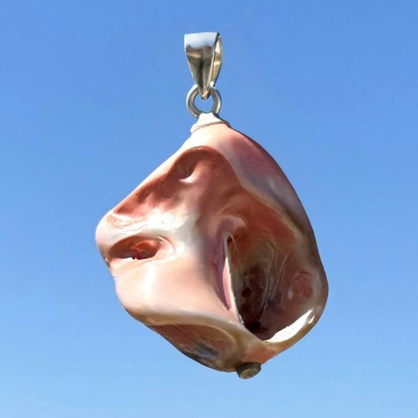 Shell pendant in salmon colour handcrafted by LENAE in London.