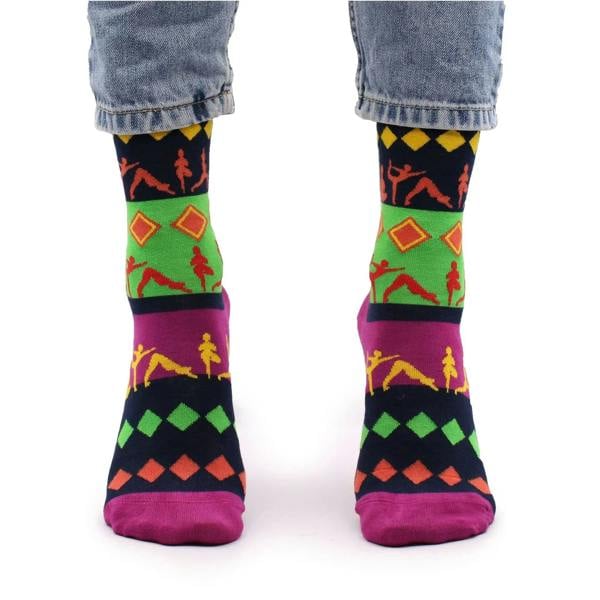 Bamboo yoga socks on feet with colorful silhouette pattern and purple toe