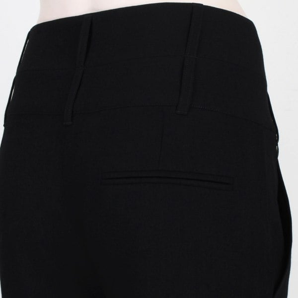 Ann Demeulermeester finely woven black wool trousers
High waisted trousers with crossover tab to waistline
Button fastening with gently tapered leg