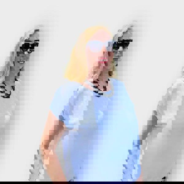 Woman wearing sunglasses and a short black aluminium single tier necklace against a plain background