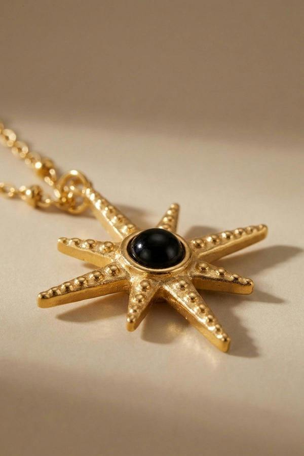 ARIIRA Gaia Gold Tone Starburst Pendant Necklace