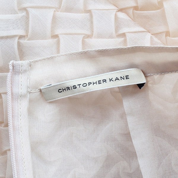 A Christopher Kane pencil skirt which is intricately shaped to appear woven
