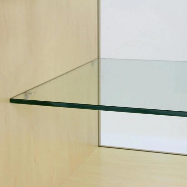 Clear glass shelf with polished edges, mounted on a light maple wood display unit, ideal for showcasing retail products