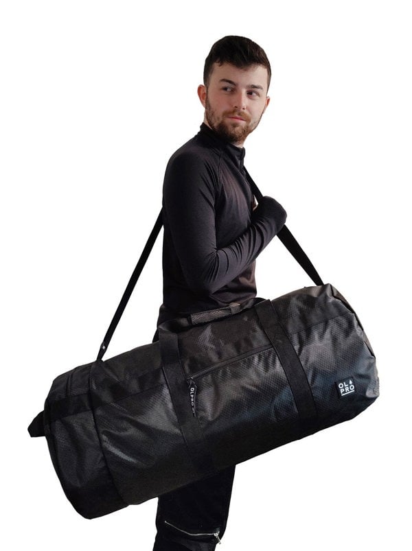 60L Black Holdall / Duffle Bag OLPRO - man with bag over right shoulder