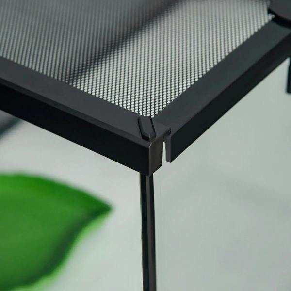 Close-up of black terrarium corner frame and mesh top edge