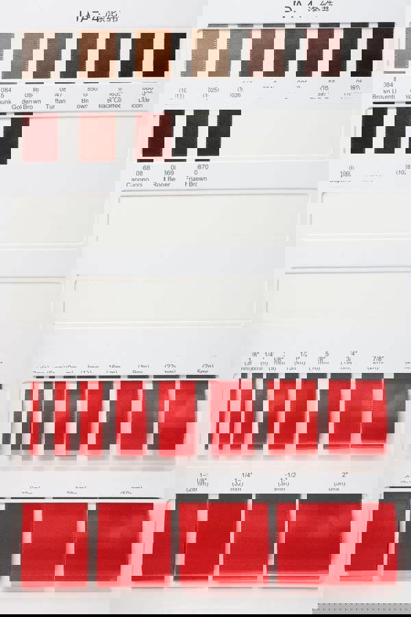 Color swatch chart with red ribbons and text on a white background