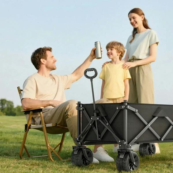 Black folding outdoor wagon cart with fabric bed and handle for carrying camping items