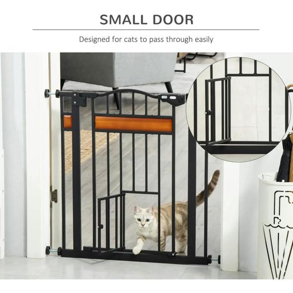 Black pet safety gate with cat flap, designed for small door passage through vertical bars