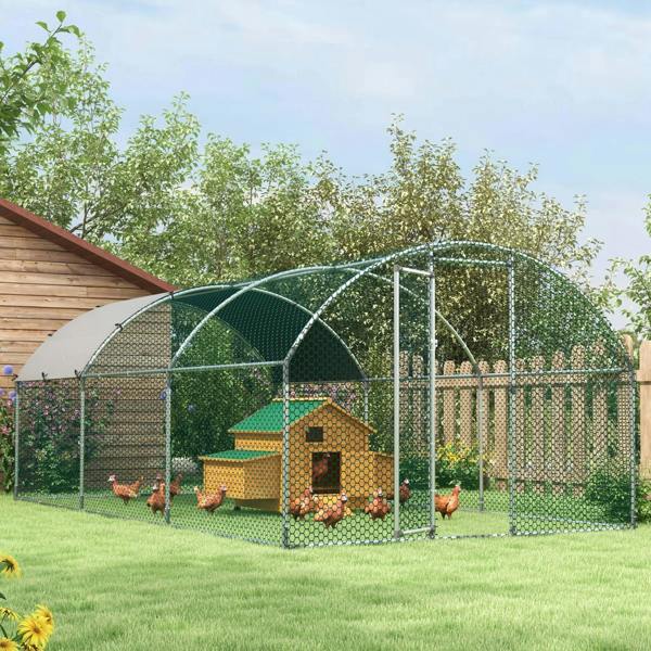 Arched wire chicken coop with covered entrance and mesh run beside fence