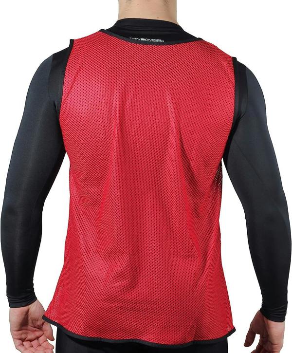 Red mesh Optimum training bib worn over black top by model, rear view on white background - Optimum