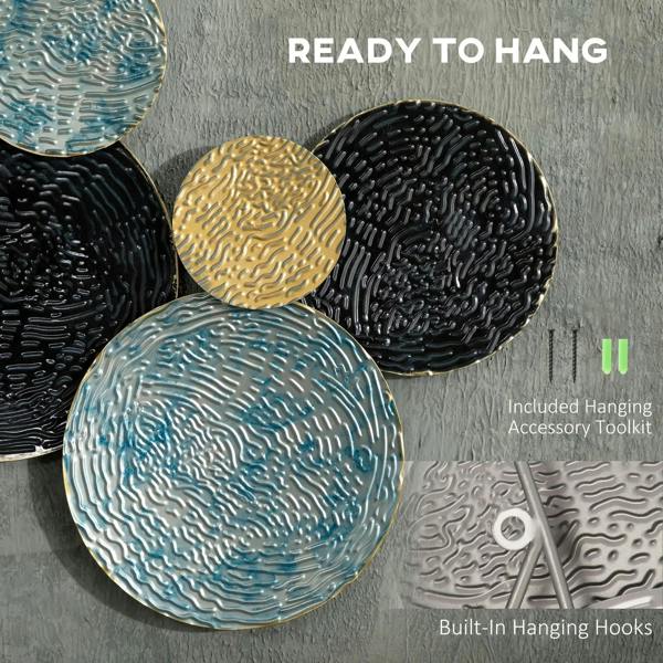 Close-up of black, blue, and gold textured metal discs with hanging hooks