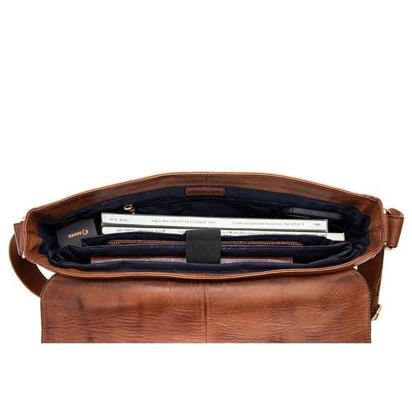 Interior of Brown leather messenger bag showing padded 13 inch laptop compartment and slip pouch