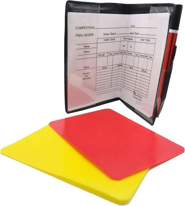 Open referee wallet with match scorecard and pencil, yellow and red cards laid in front - Optimum