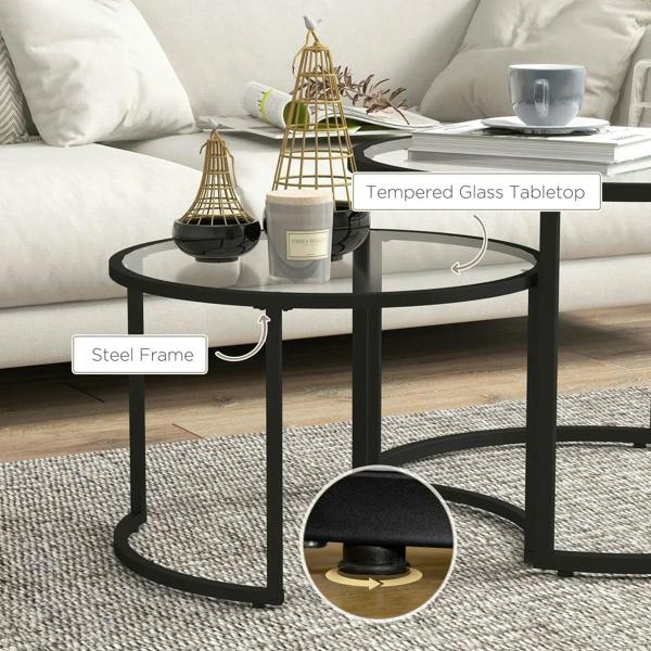 Black nesting coffee tables with tempered glass tabletop and steel frame design.