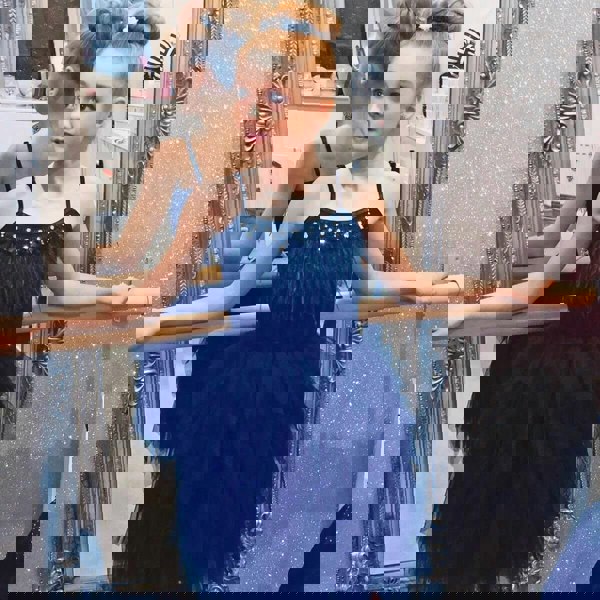 Girl wearing black ballerina style dress