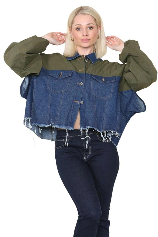 Woman wearing a two-tone denim and green jacket on a beige background