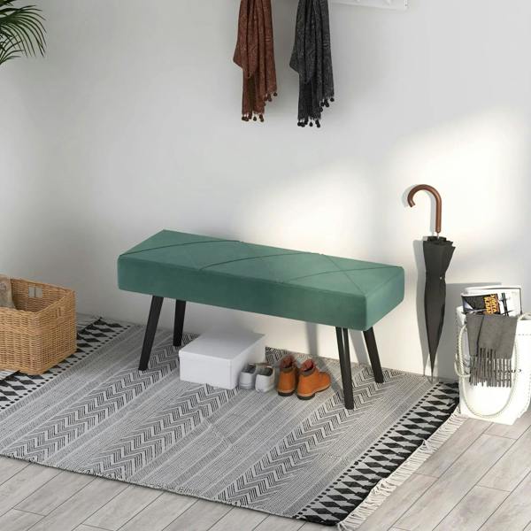 Green upholstered end-of-bed bench with dark steel legs, side view