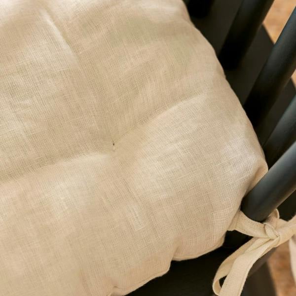 Macro shot of the natural linen fibers of the Chalk seat pad.