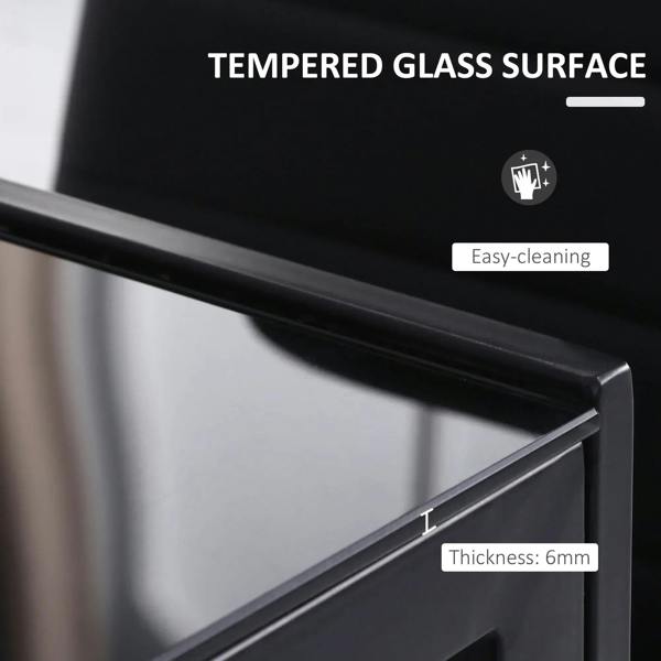 Tempered glass tabletop edge on a black dining table with metal frame