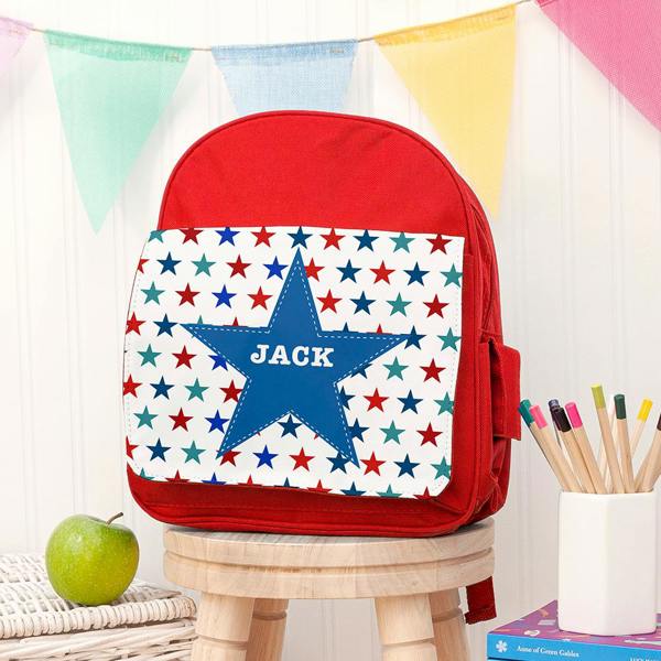 Personalised bright red mini rucksack with a multi-coloured star front pocket custom printed with the name Jack.