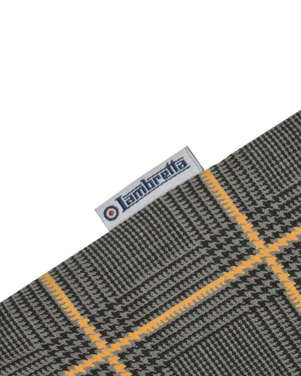 Lambretta Mens Prince of Wales Check Mod Ska Casual Polo, close-up of fabric detail with a branded tag.