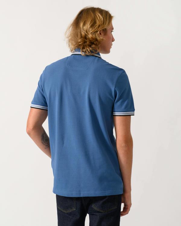 studio photograph showing the back of a model wearing a BOSS Green Paddy Mens Cotton-Piqué Polo Shirt with Contrast Logo in Medium Blue 428