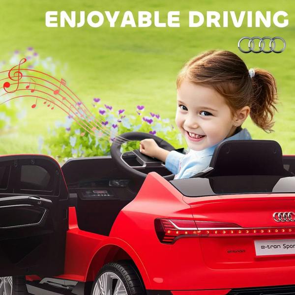 Red kids electric ride-on car with smiling child seated at the wheel