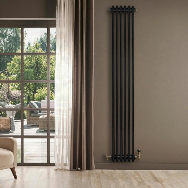 Traditional black 4 column radiator, 1800 x 290mm, featuring a sleek design and elegant finish, mounted on a wall in a stylish room