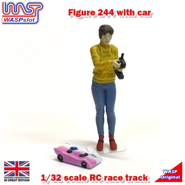a toy figurine of a woman holding a camera