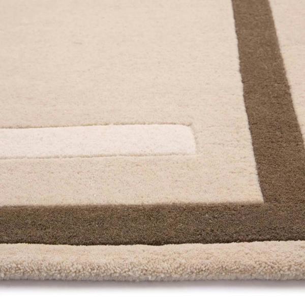 Close-up of a beige and brown striped rug on a white background