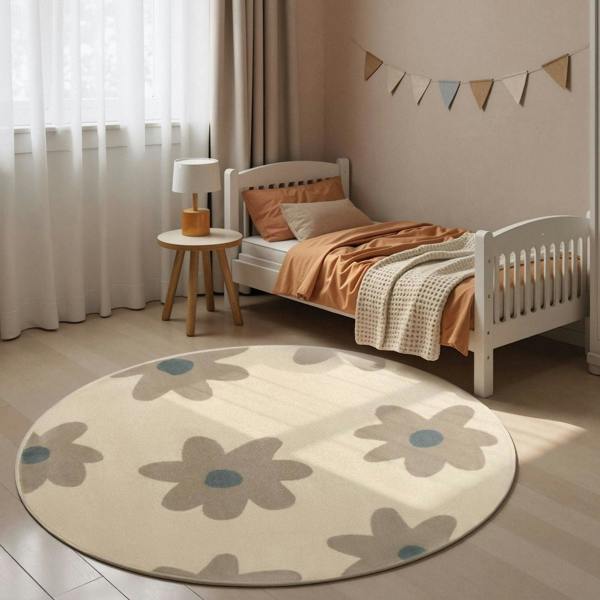 Children's bedroom with a round floral rug, bed, and side table.