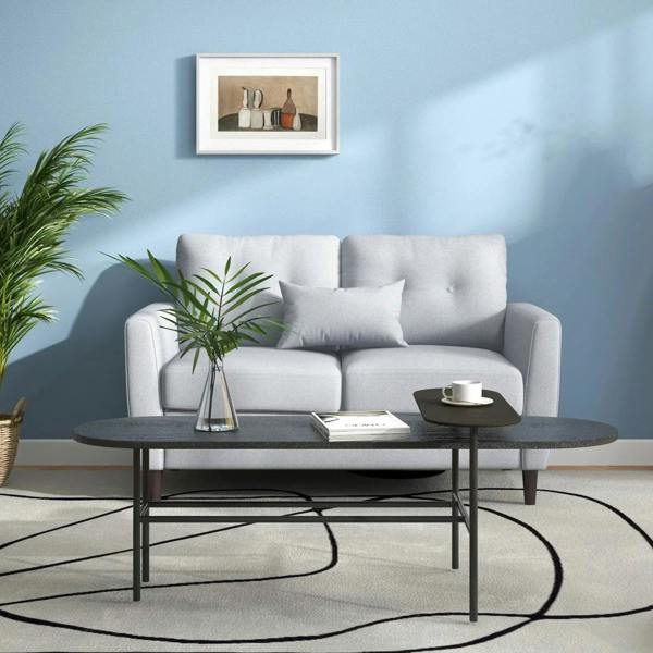 Light grey fabric two-seater sofa with button-tufted back and deep seat cushions