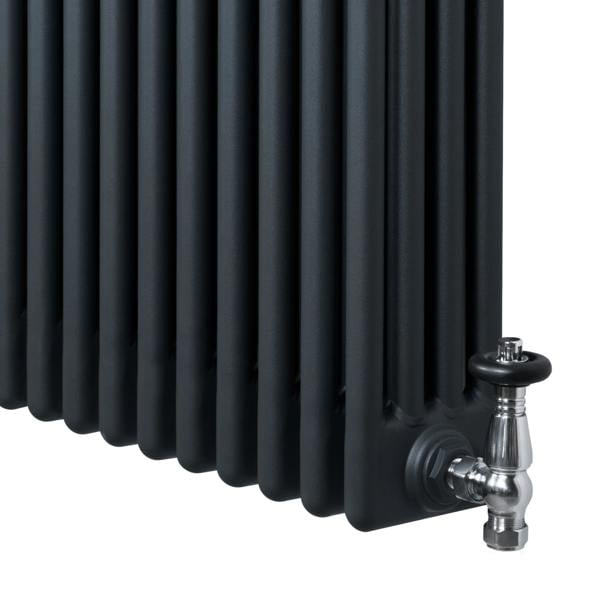 Traditional 4 column radiator in anthracite grey, featuring a sleek design with smooth, vertical fins and polished valves