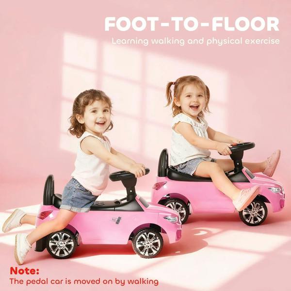 Pink foot-to-floor ride-on car for toddlers with black steering handle