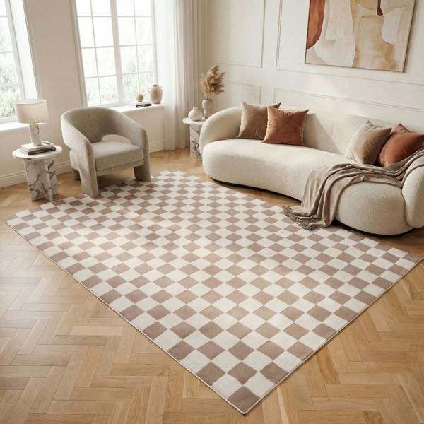 Living room with a checkered rug, beige sofa, and armchair.