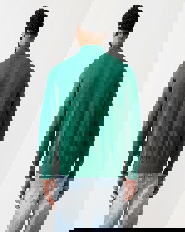 back shot of a model wearing a GANT Mens Classic Cotton Half Zip Jumper in Deep Forest Green