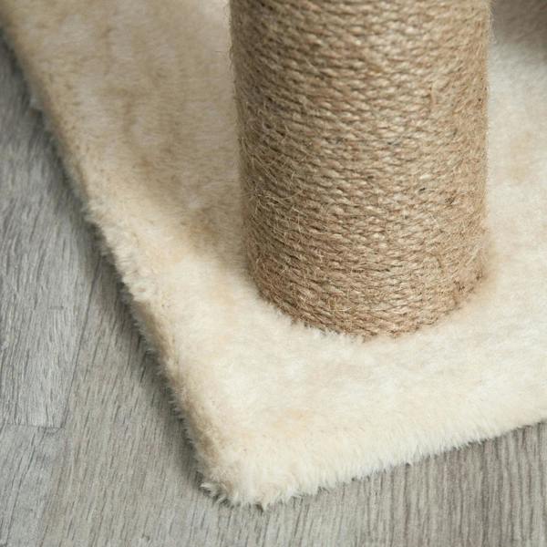 Cat tree plush base edge beside sisal scratching post